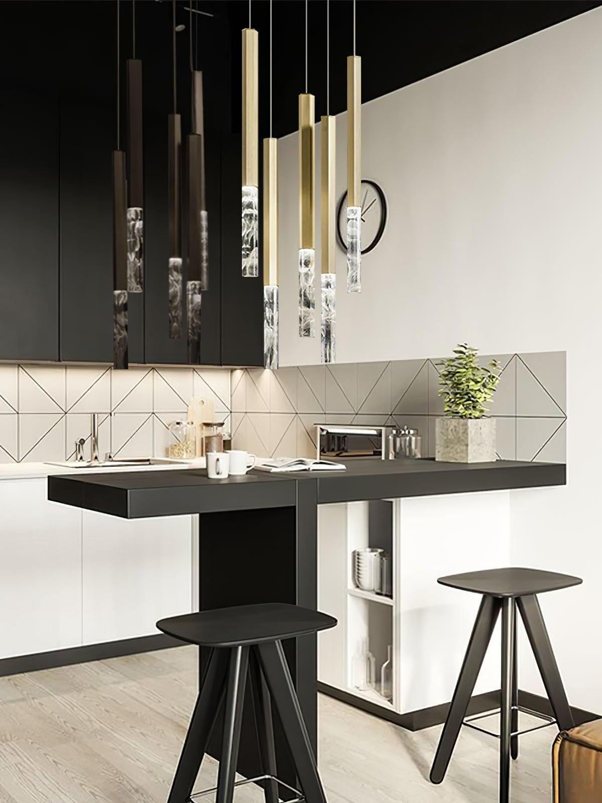 Cluster of slim crystal pendants above a counter