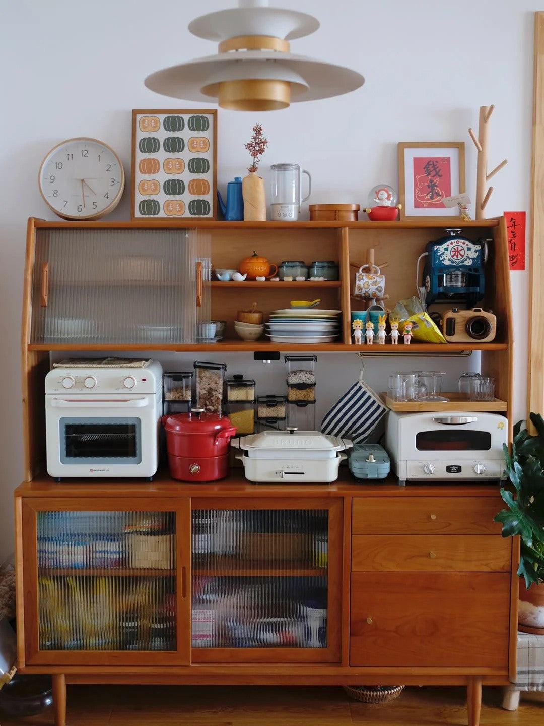 Pendant in front of kitchen storage shelves
