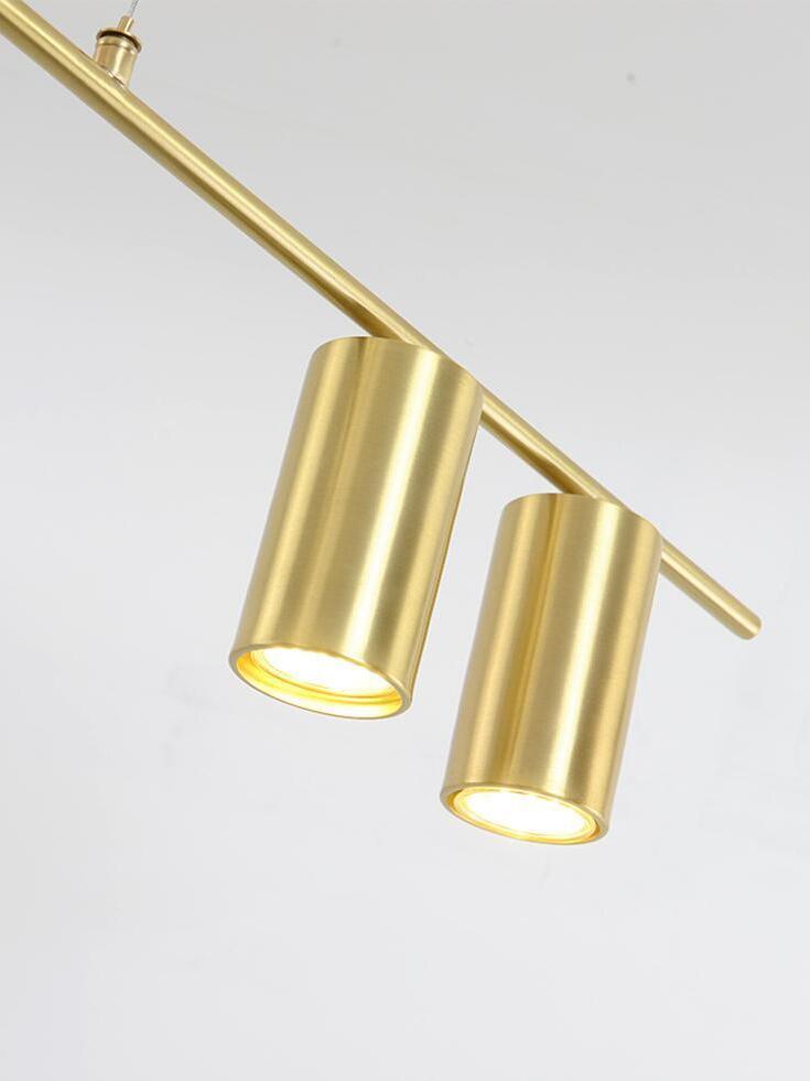 Two illuminated cylindrical heads along a gold-coloured rod