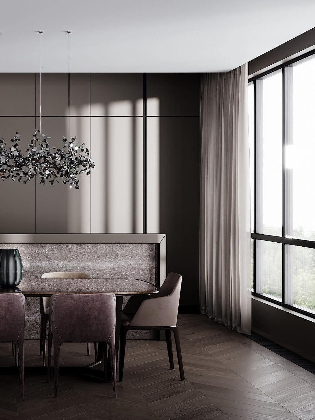 Silver suspended disc cluster beside a dining table and window