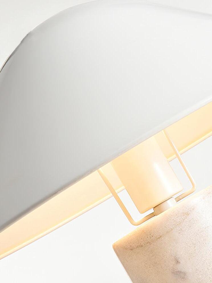 Close view beneath white metal cone shade
