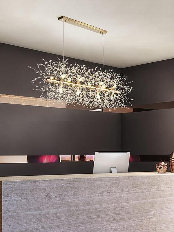 Suspended glass-branch light above a counter