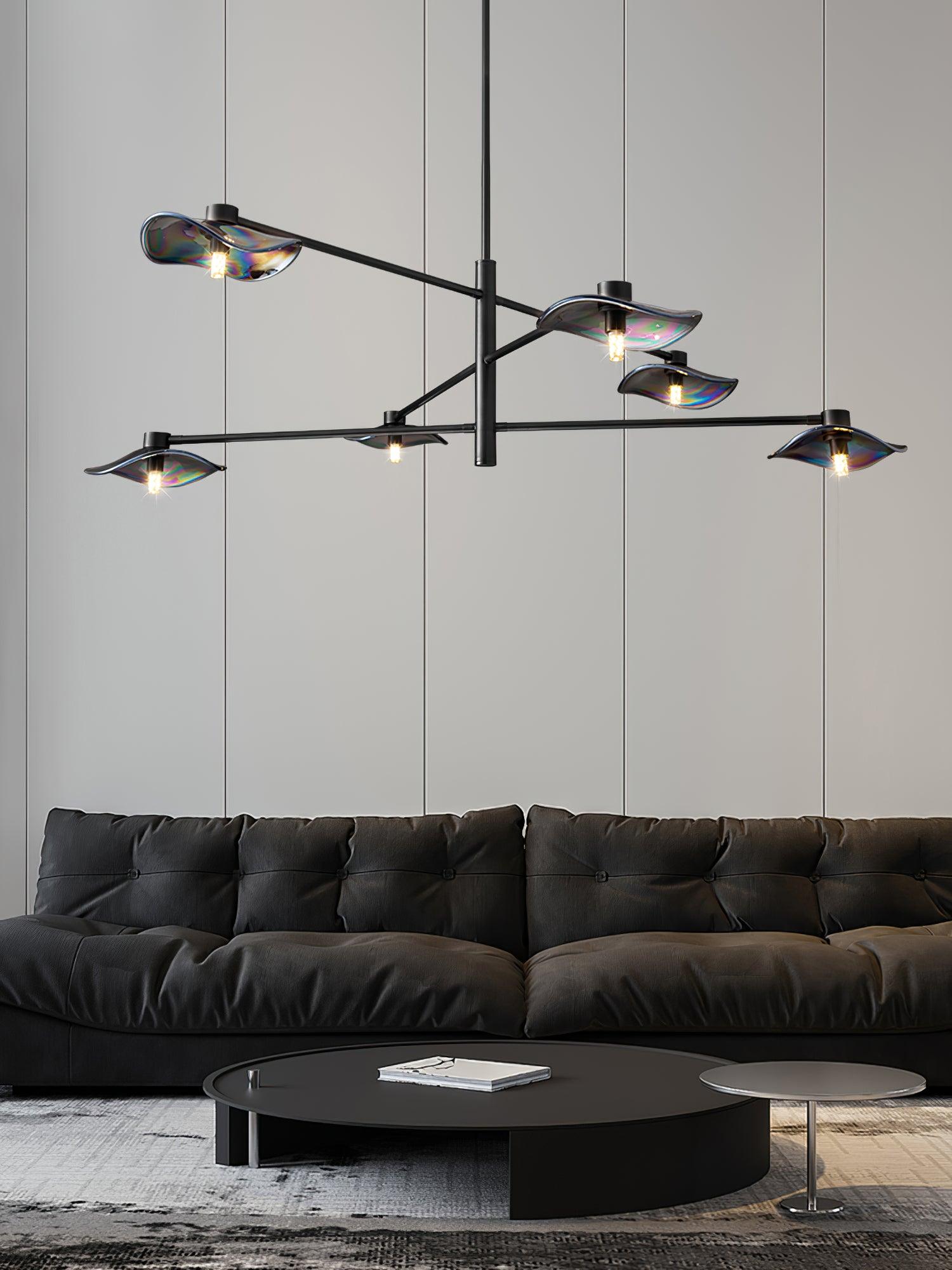 Black Calla chandelier above a dark sofa