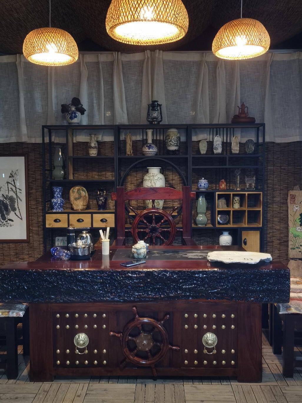 Three separate woven pendants above a dark counter