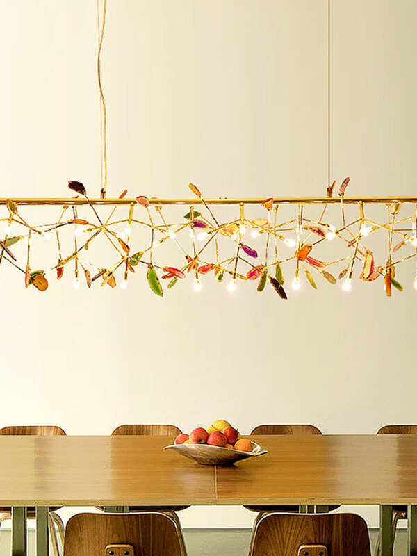 Long Multicolor chandelier above a wood table