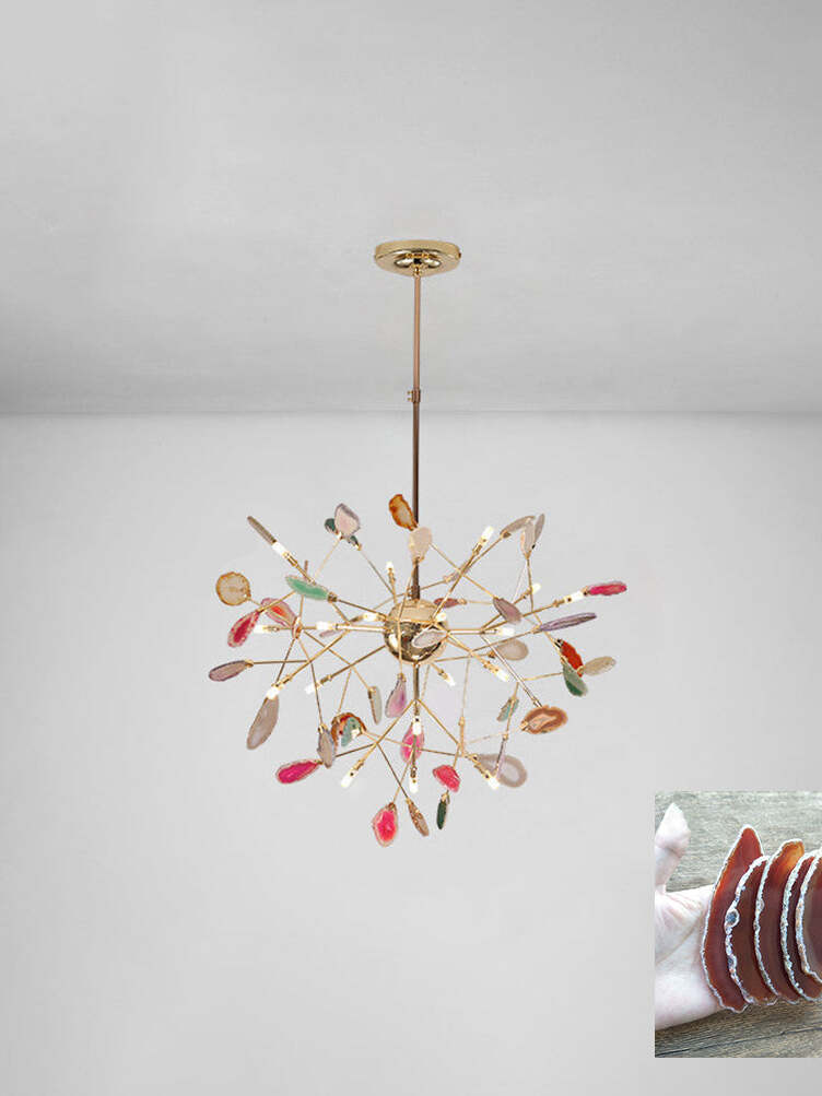 Radial multicoloured chandelier beneath a pale ceiling with an orange-toned stone sample inset