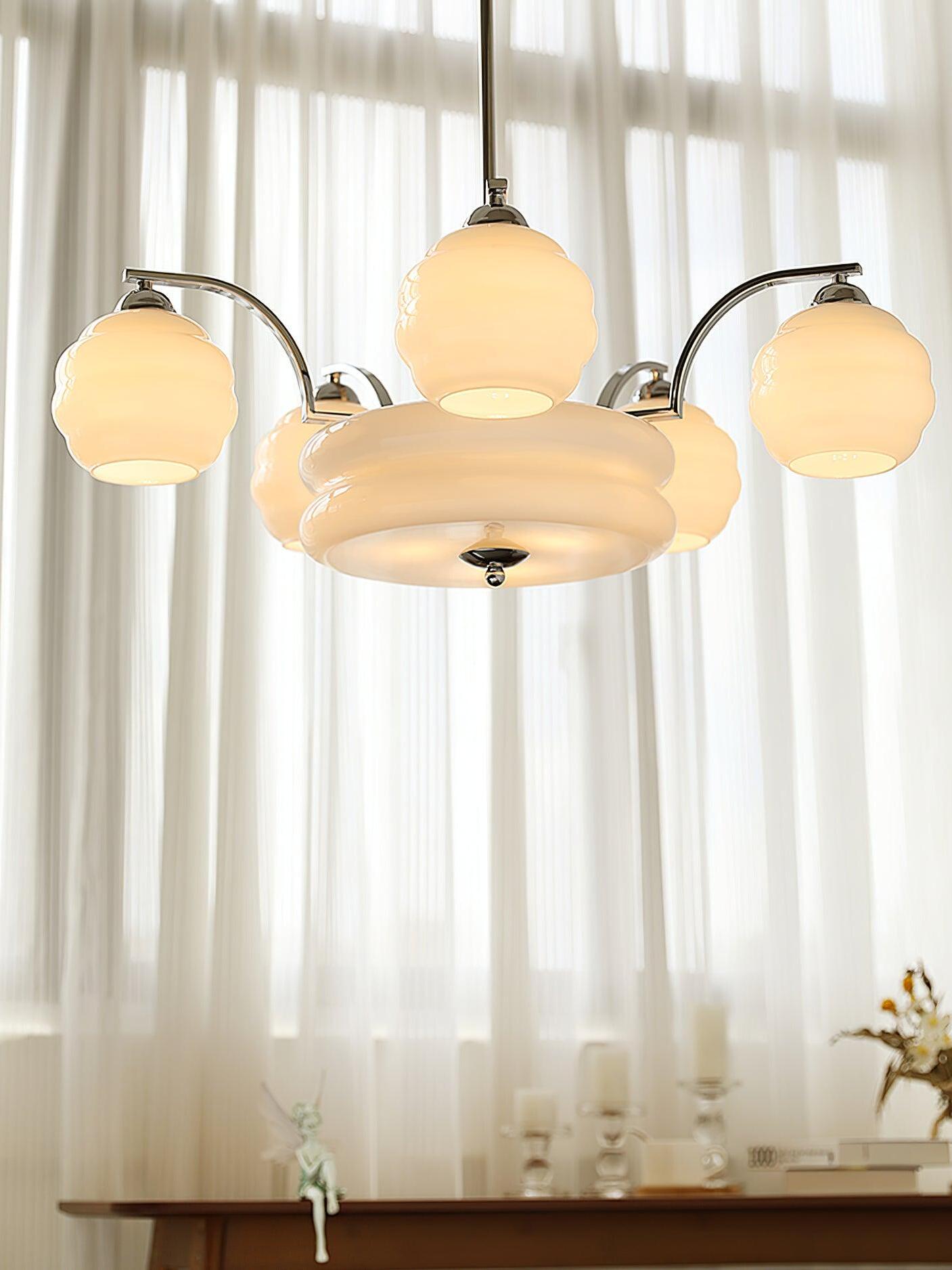 Underside of chrome chandelier near a window