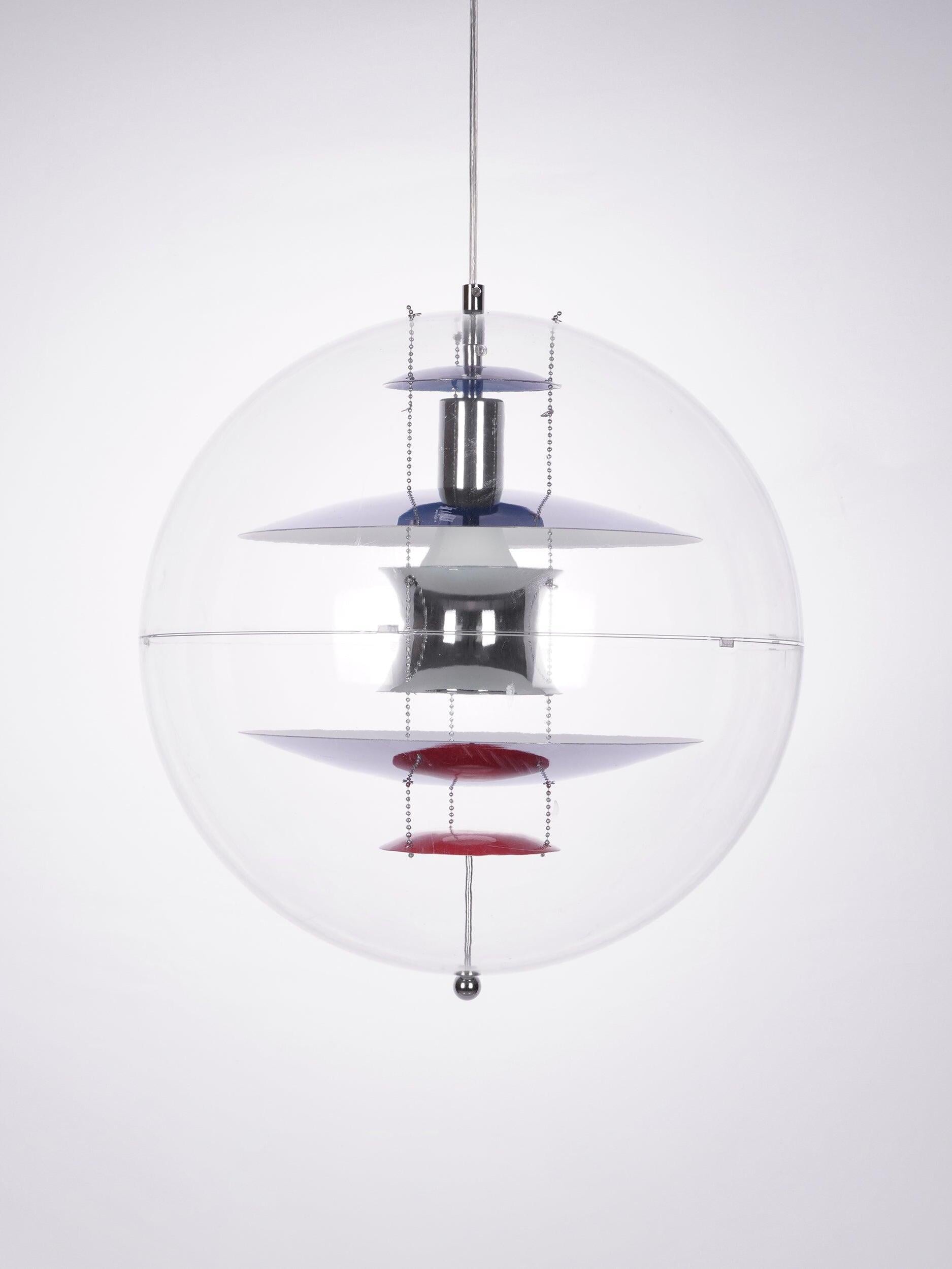 Frontal clear globe with stacked silver-tone reflectors, blue upper discs, red lower discs and a small bottom ball