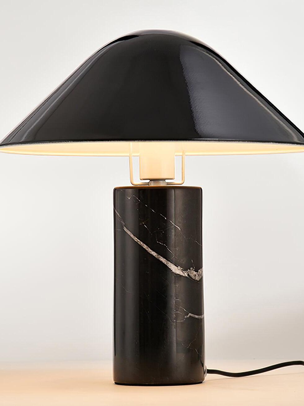 Black marble table lamp with power cord visible