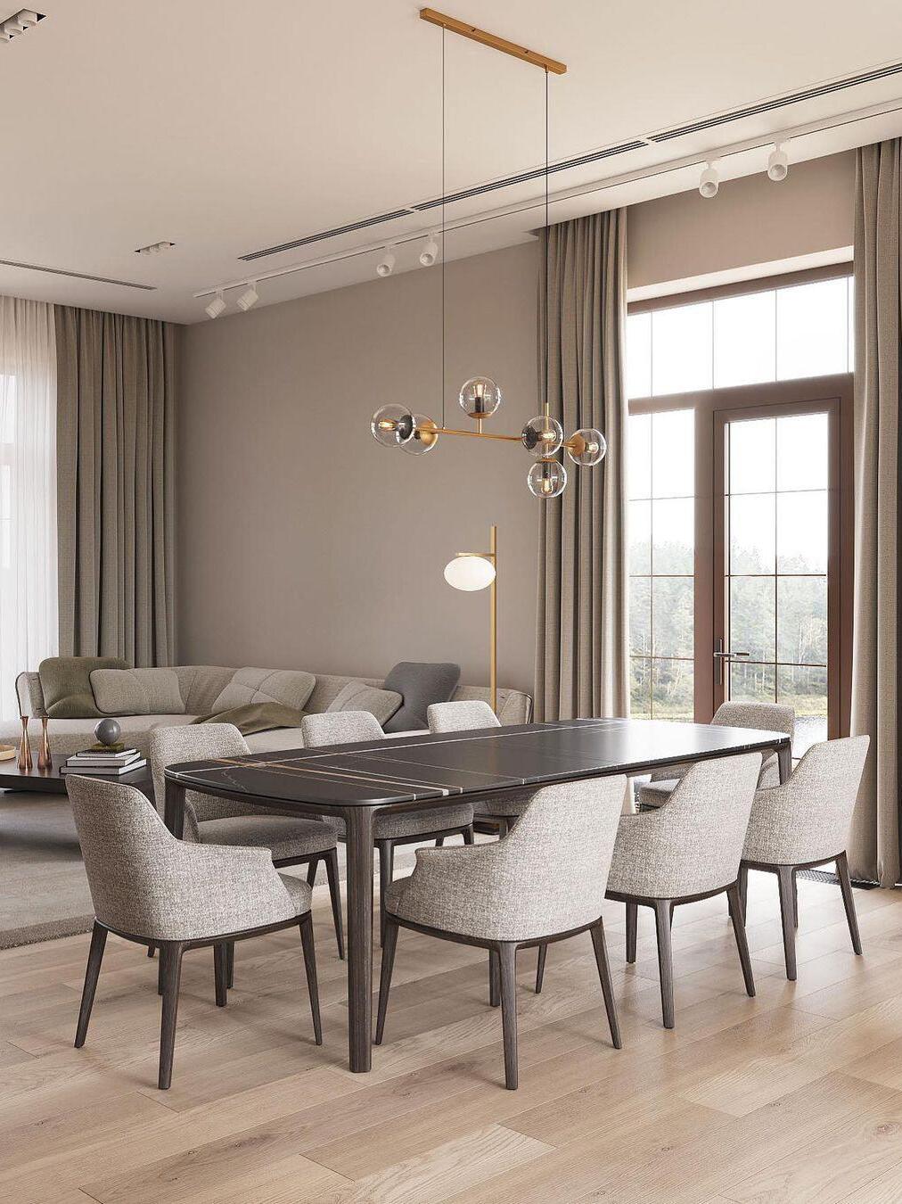 Long-suspended globe chandelier above a dining table