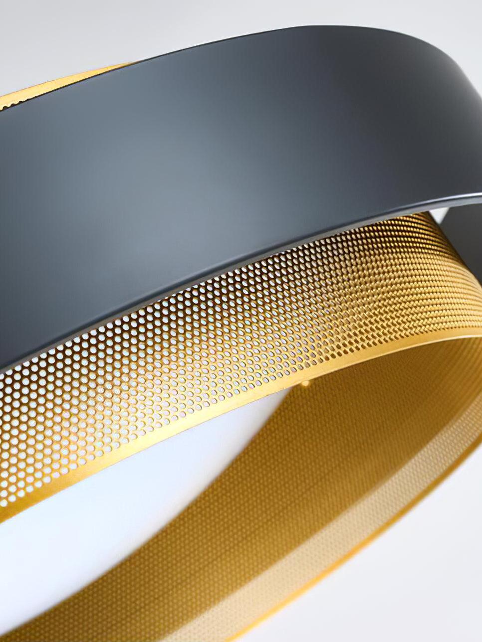 Angled close-up of the black Nolan band, perforated gold ring and white diffuser