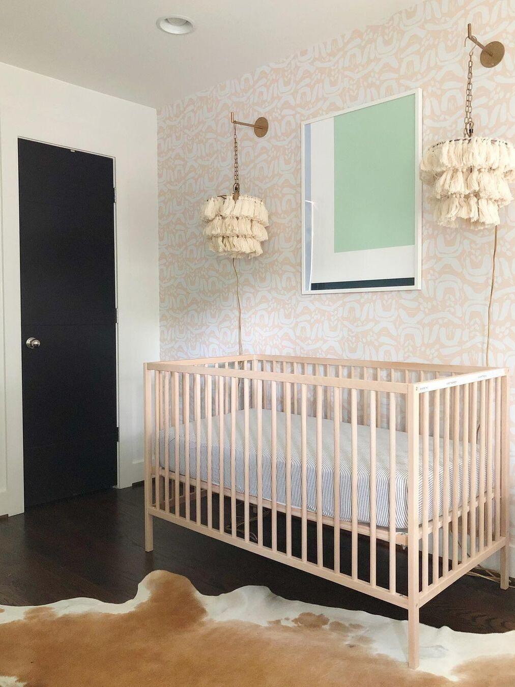 White tassel fixtures pictured above a cot