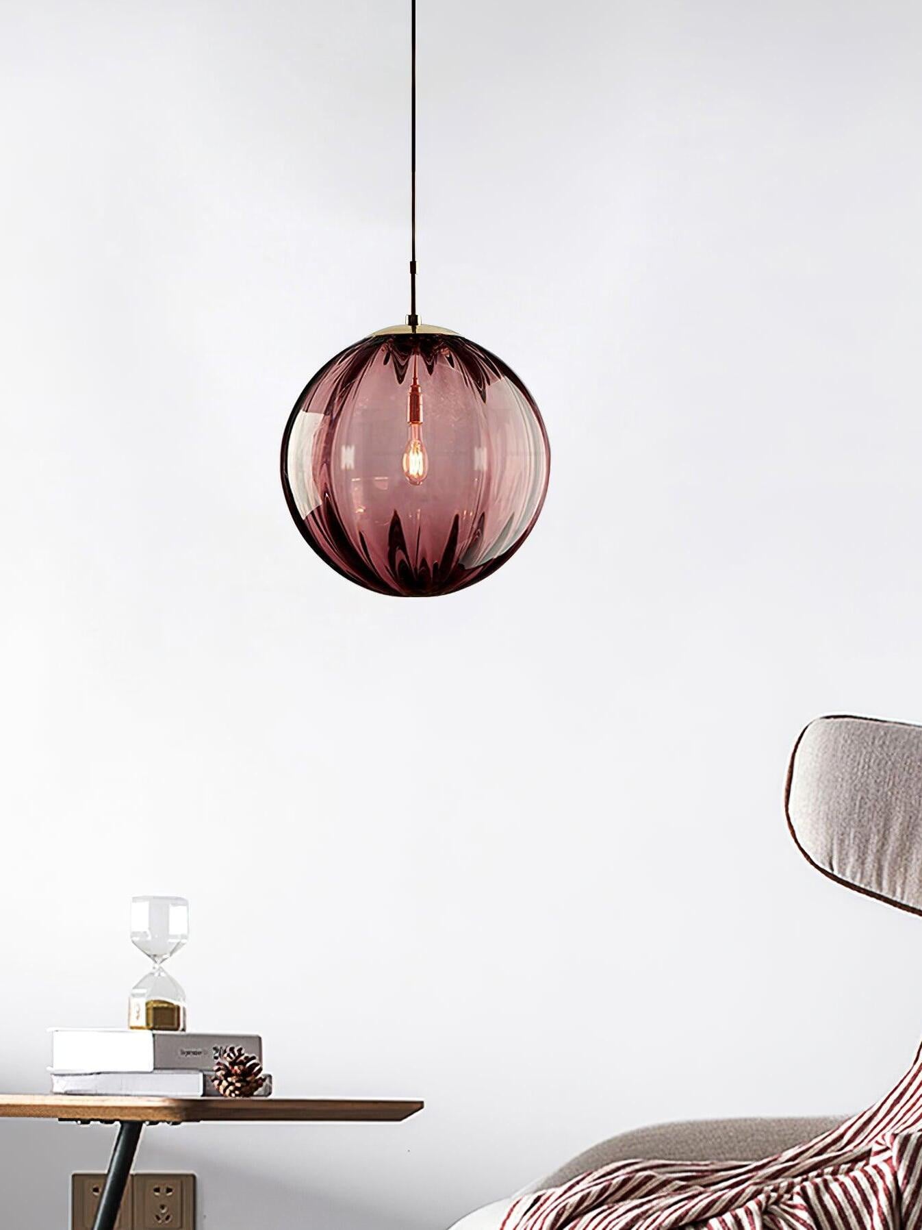 Wine red fluted glass globe in an interior