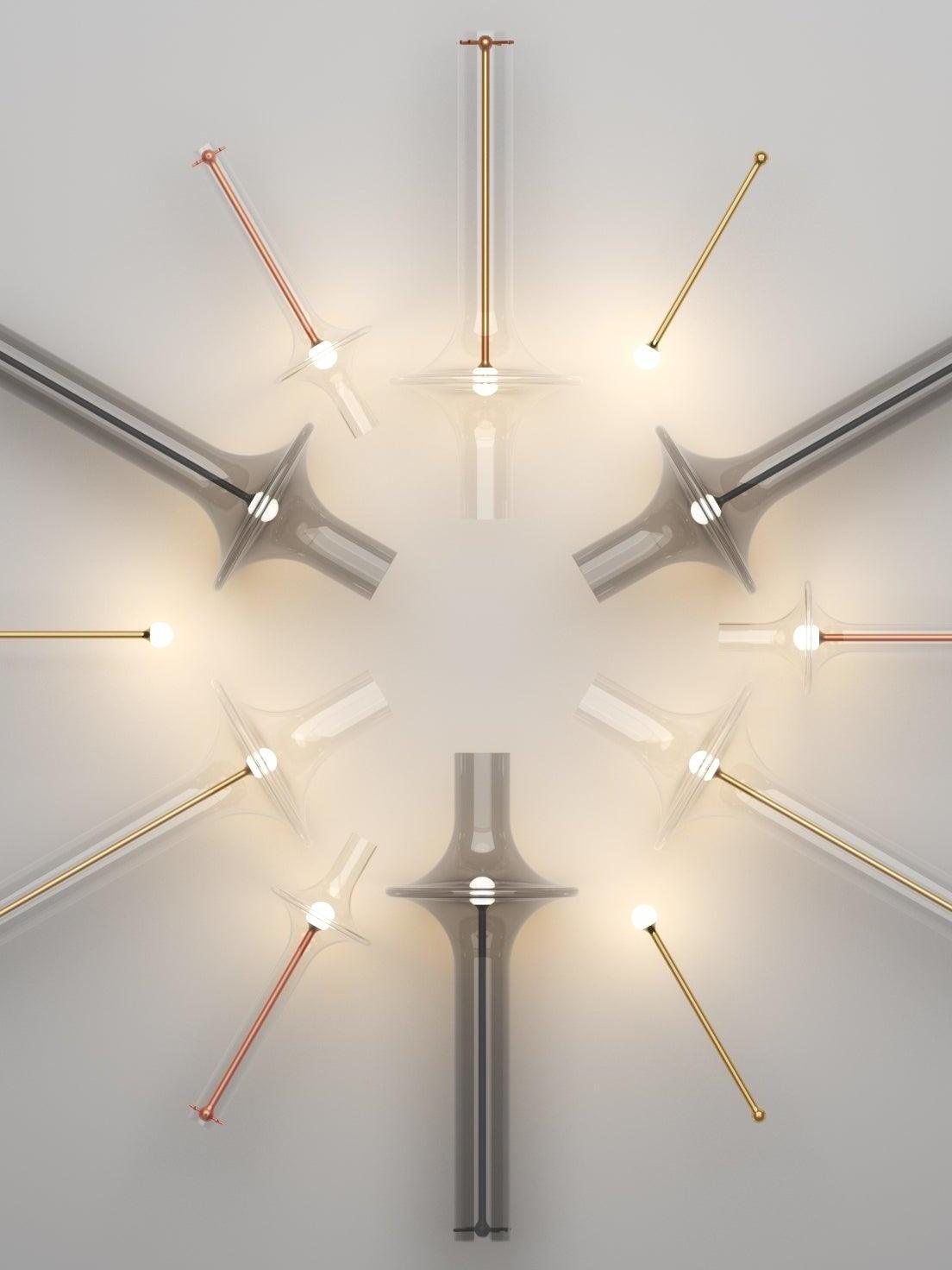 Radial arrangement graphic of clear and smoky glass shades, coloured central stems and exposed light modules