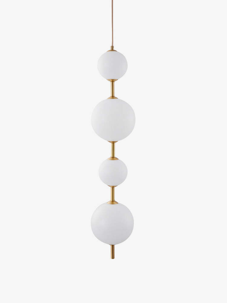 Four alternating-size white globes joined by brass-tone stems, isolated against white