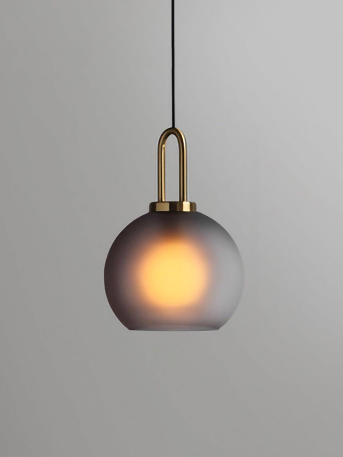 Small smoky frosted globe with a glowing bulb inside