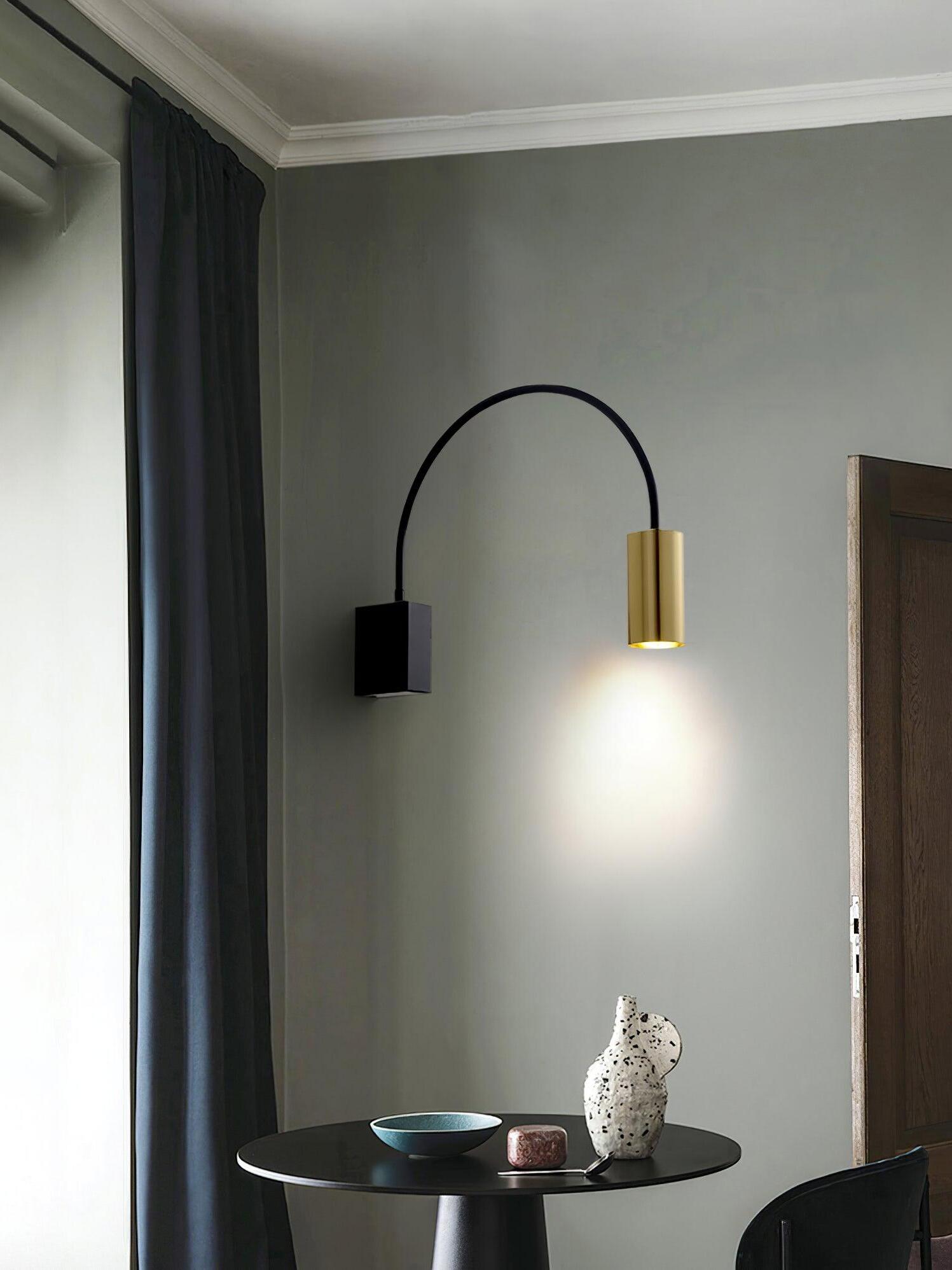 Antonella lamp above a side table near a mirrored wall