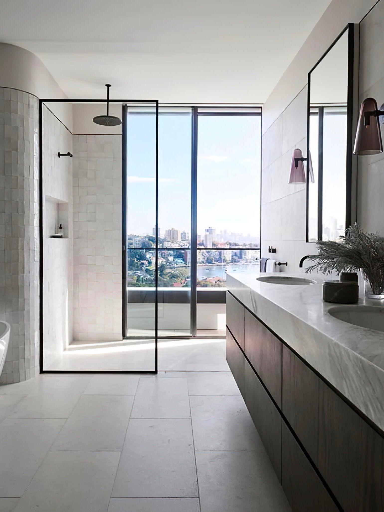 Wall lighting in a bathroom overlooking a city