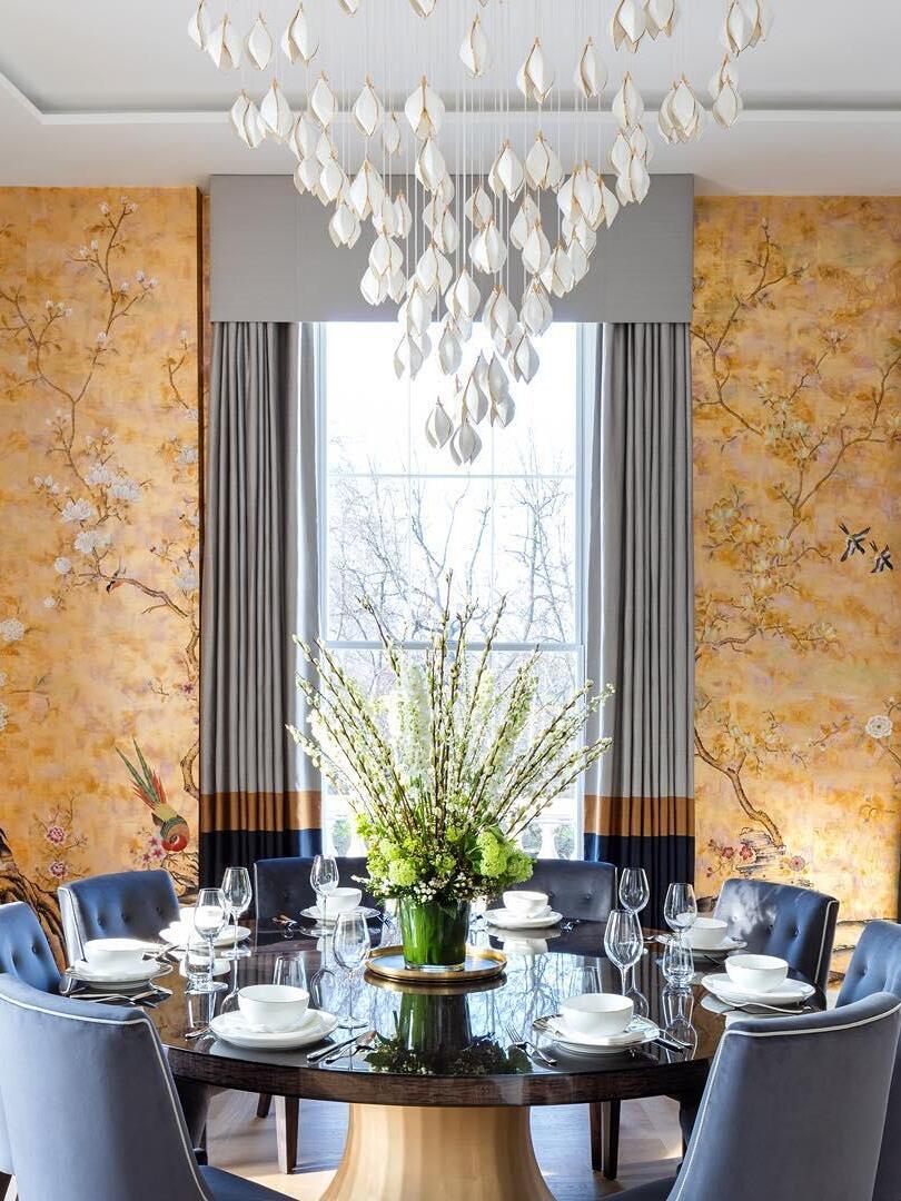 Large floral pendant arrangement over a dining table