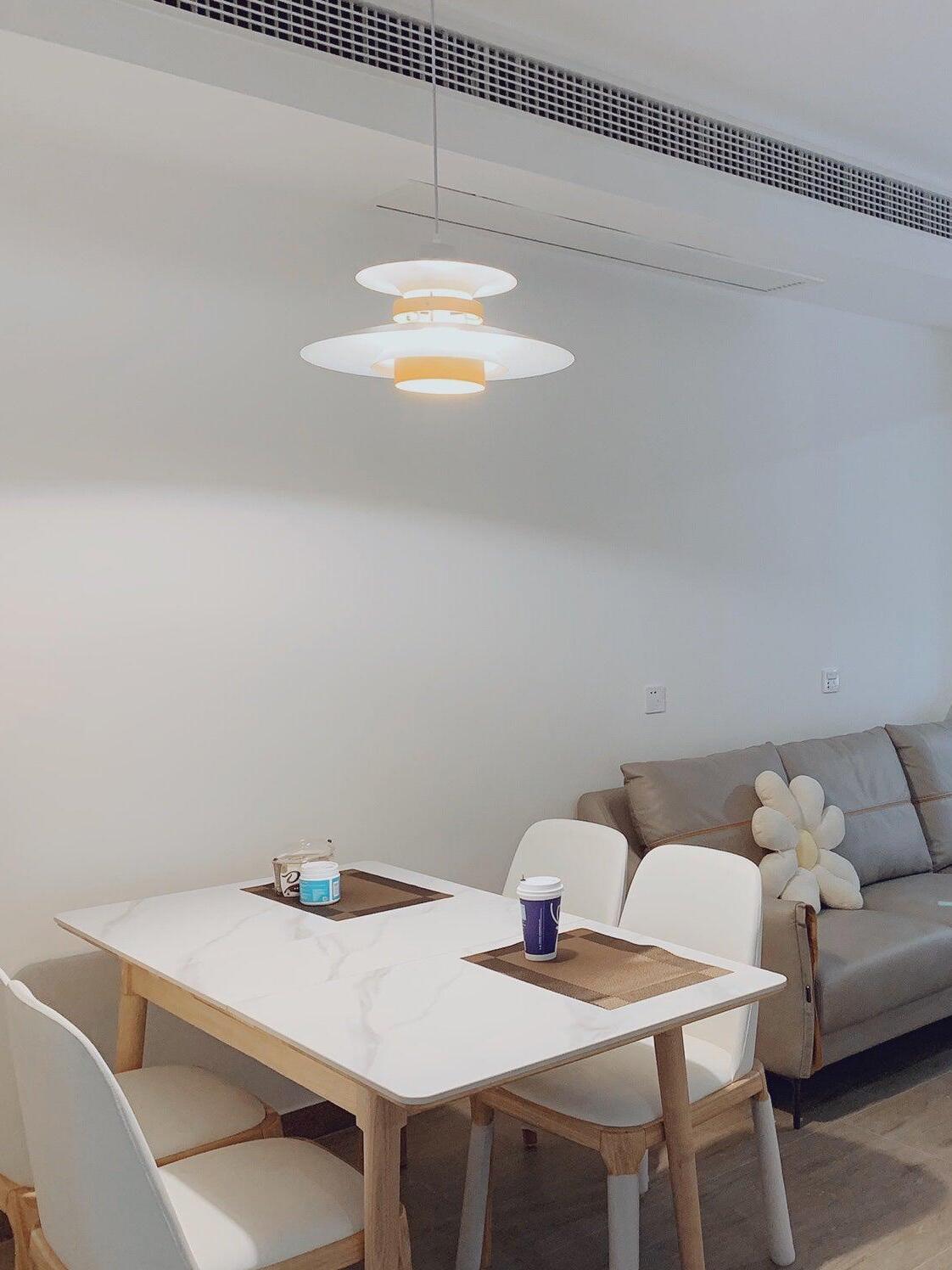 Pendant over a small table beside a sofa