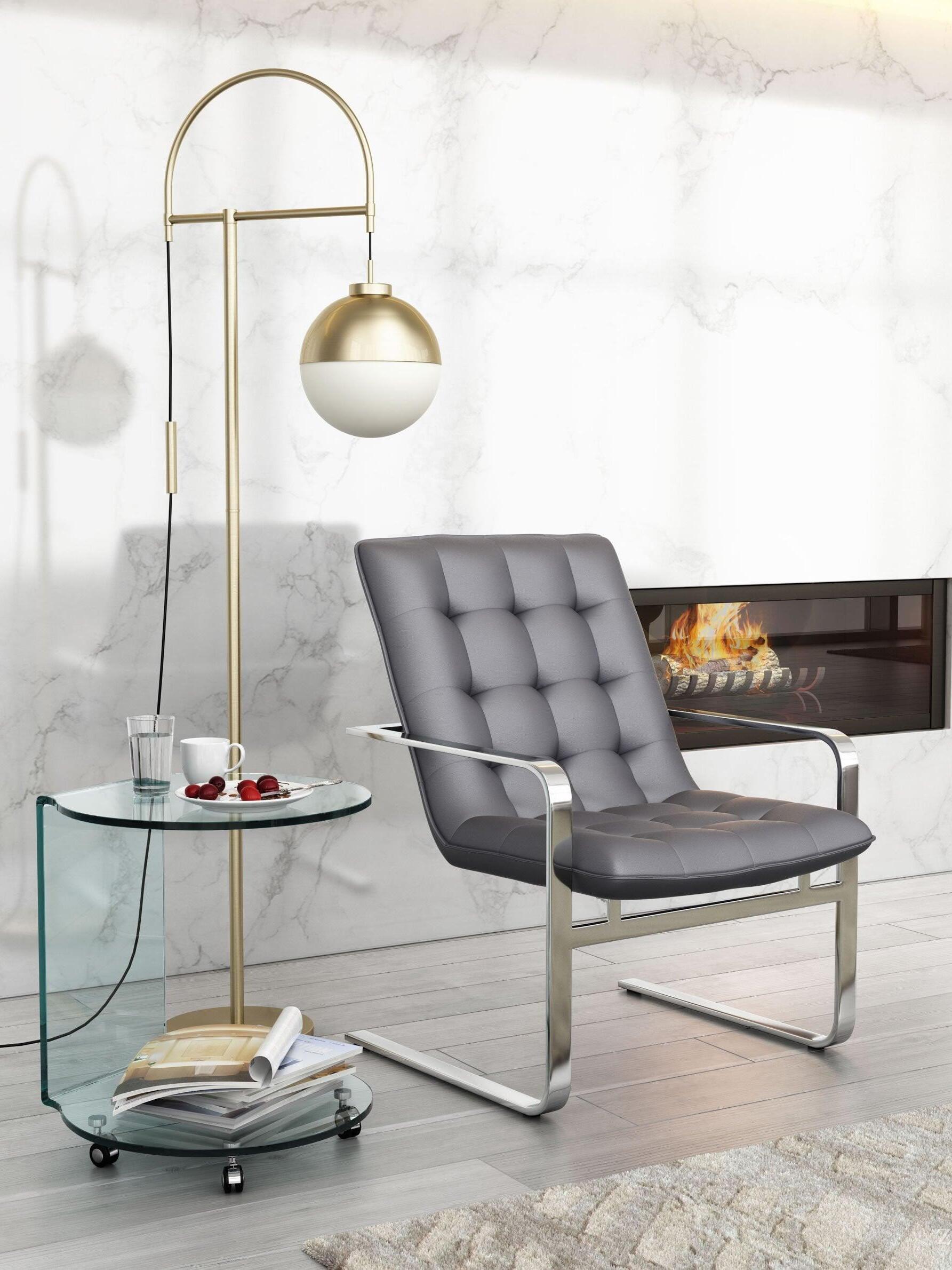 Waterloo Gold floor lamp beside grey seating and a fireplace