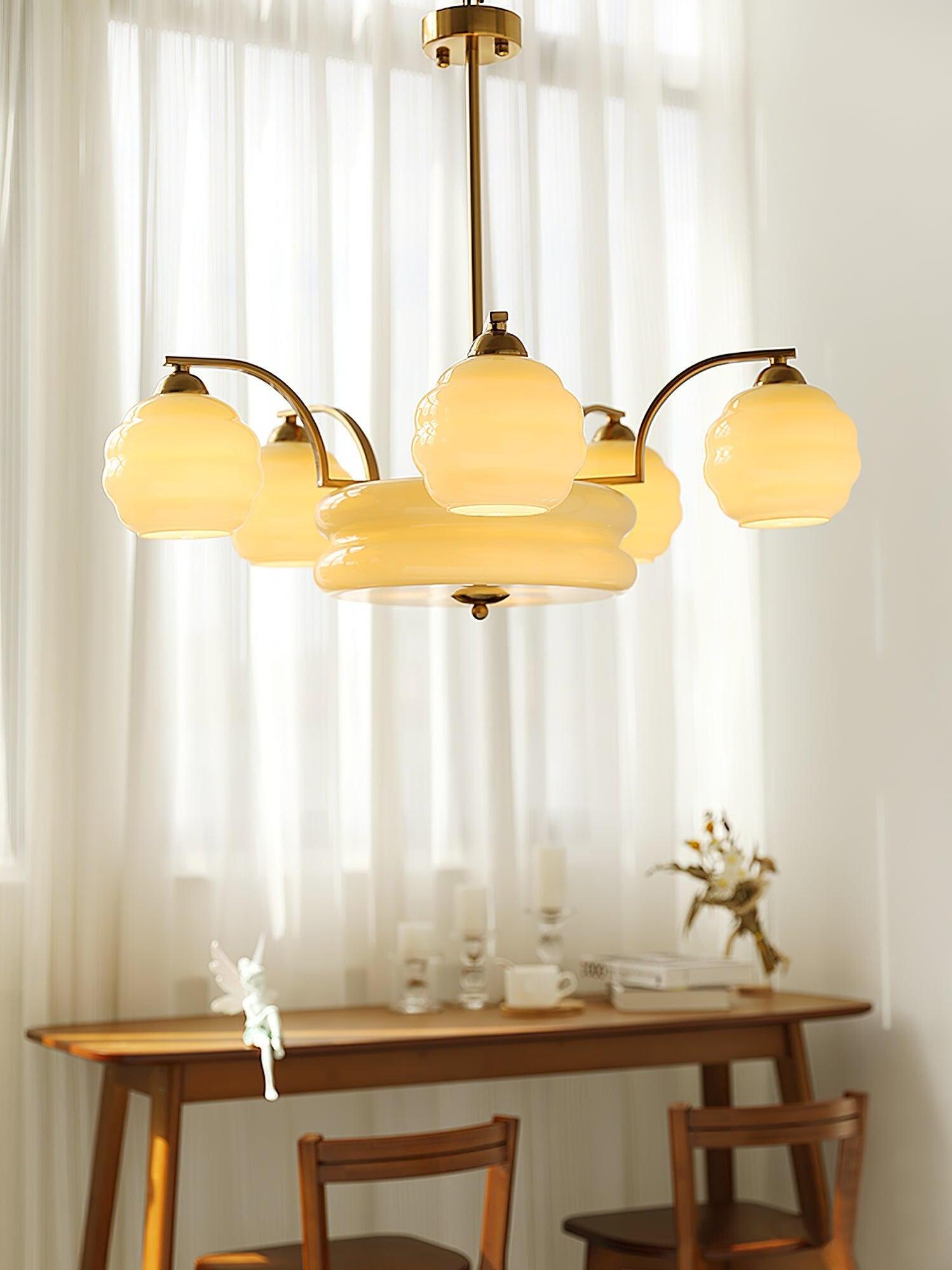 Glass chandelier above a narrow table