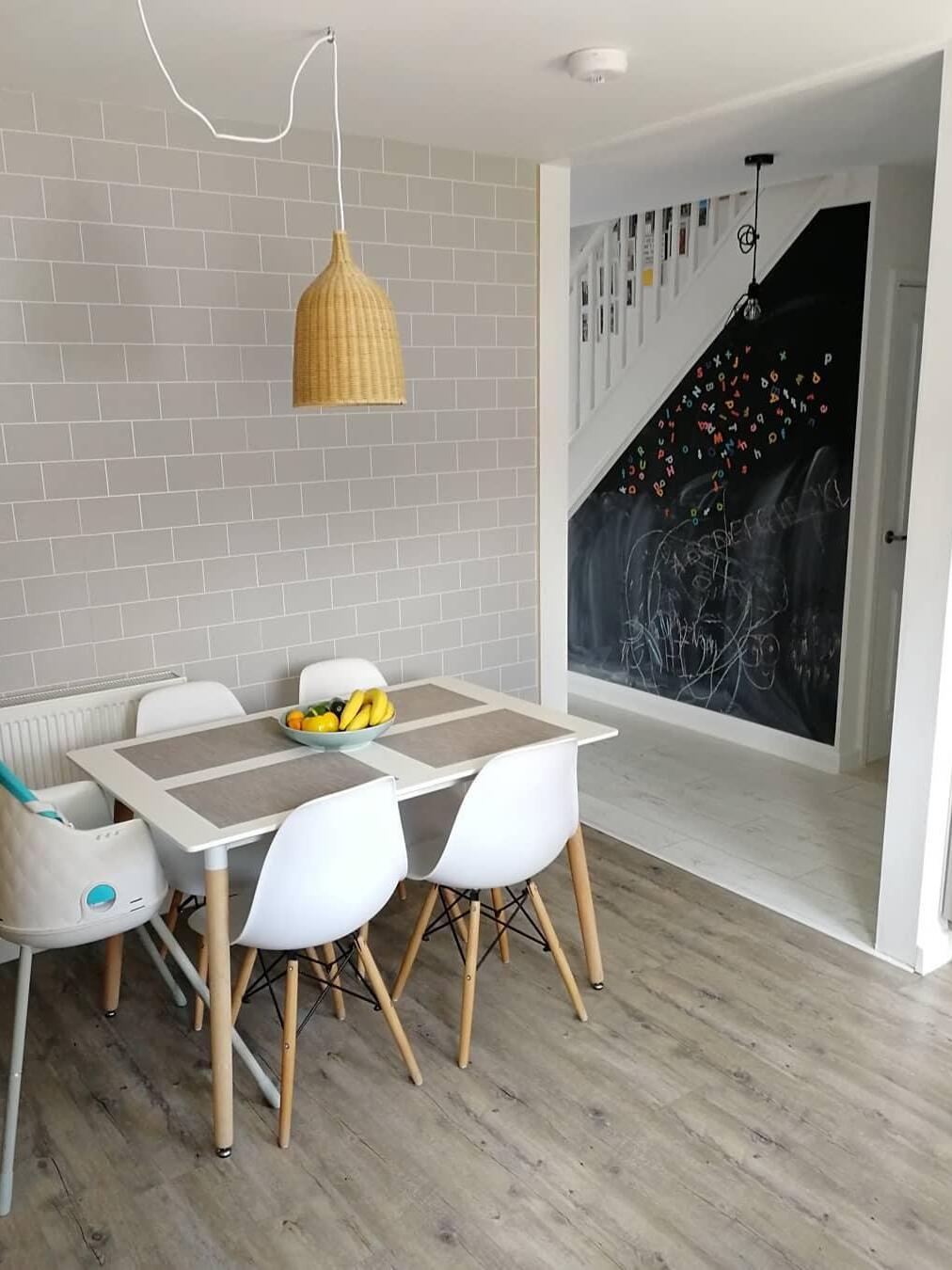 Woven pendant over a compact dining table