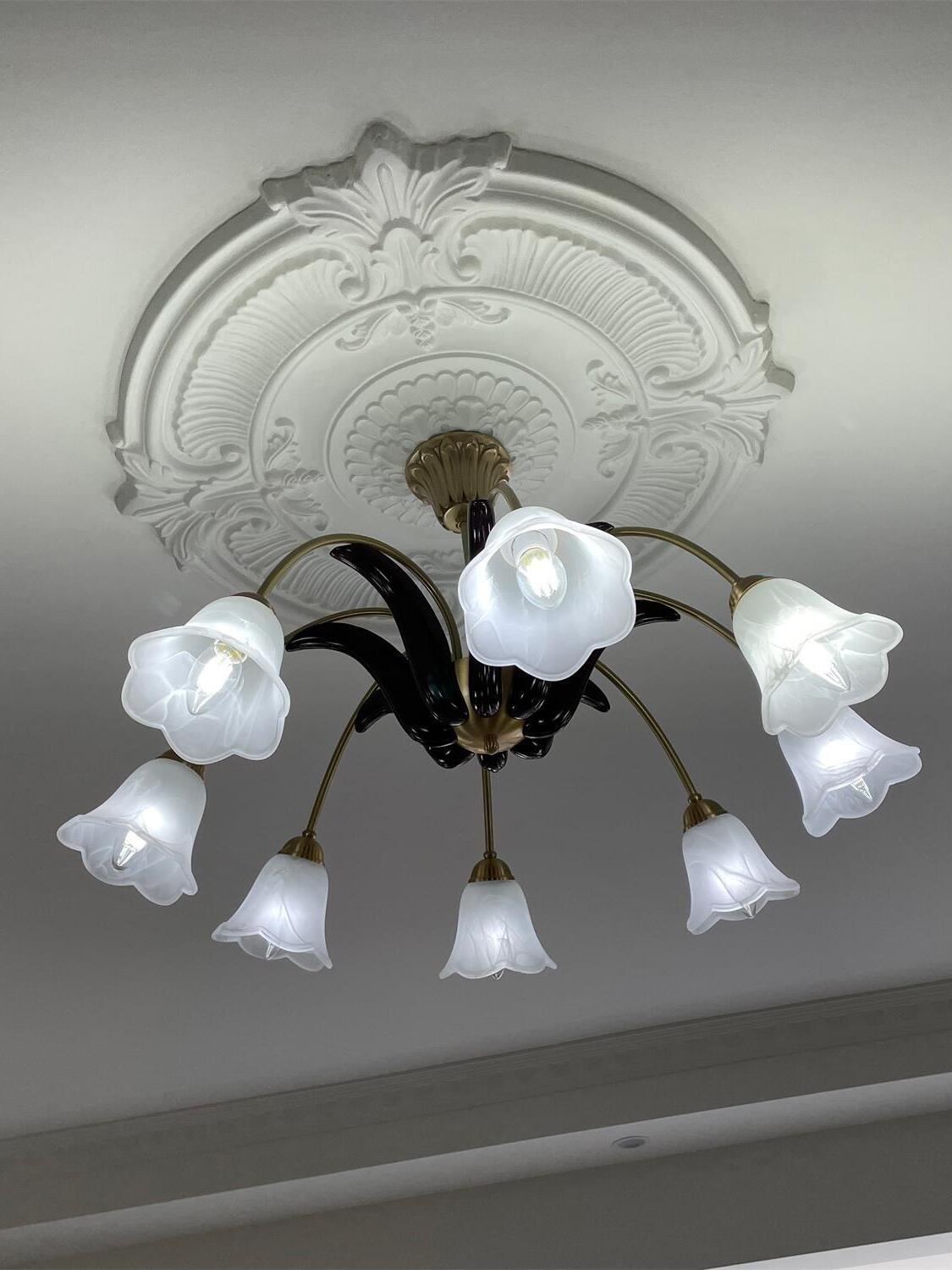 White glass flower shades viewed from below