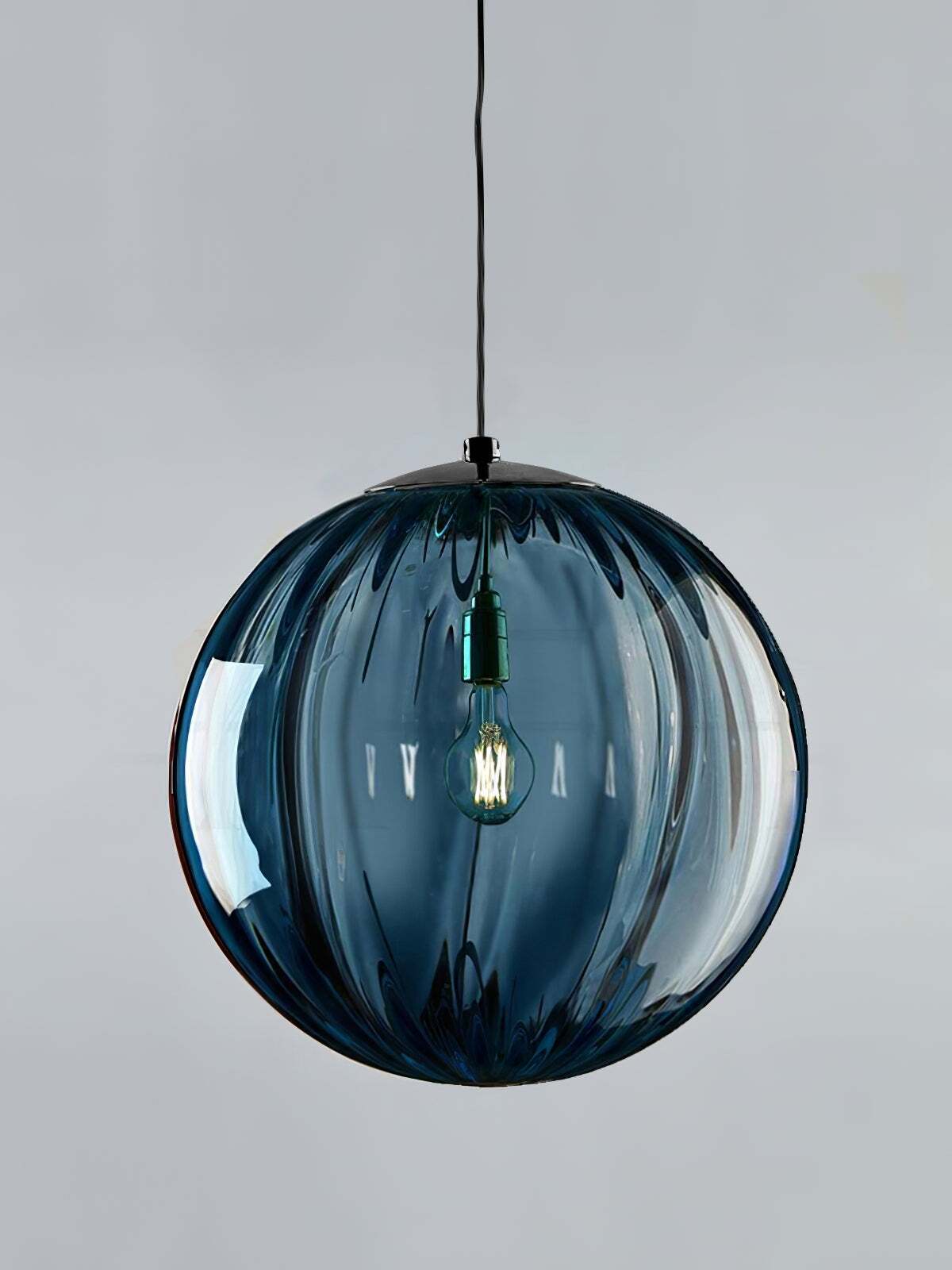 Dark blue fluted globe with visible internal light