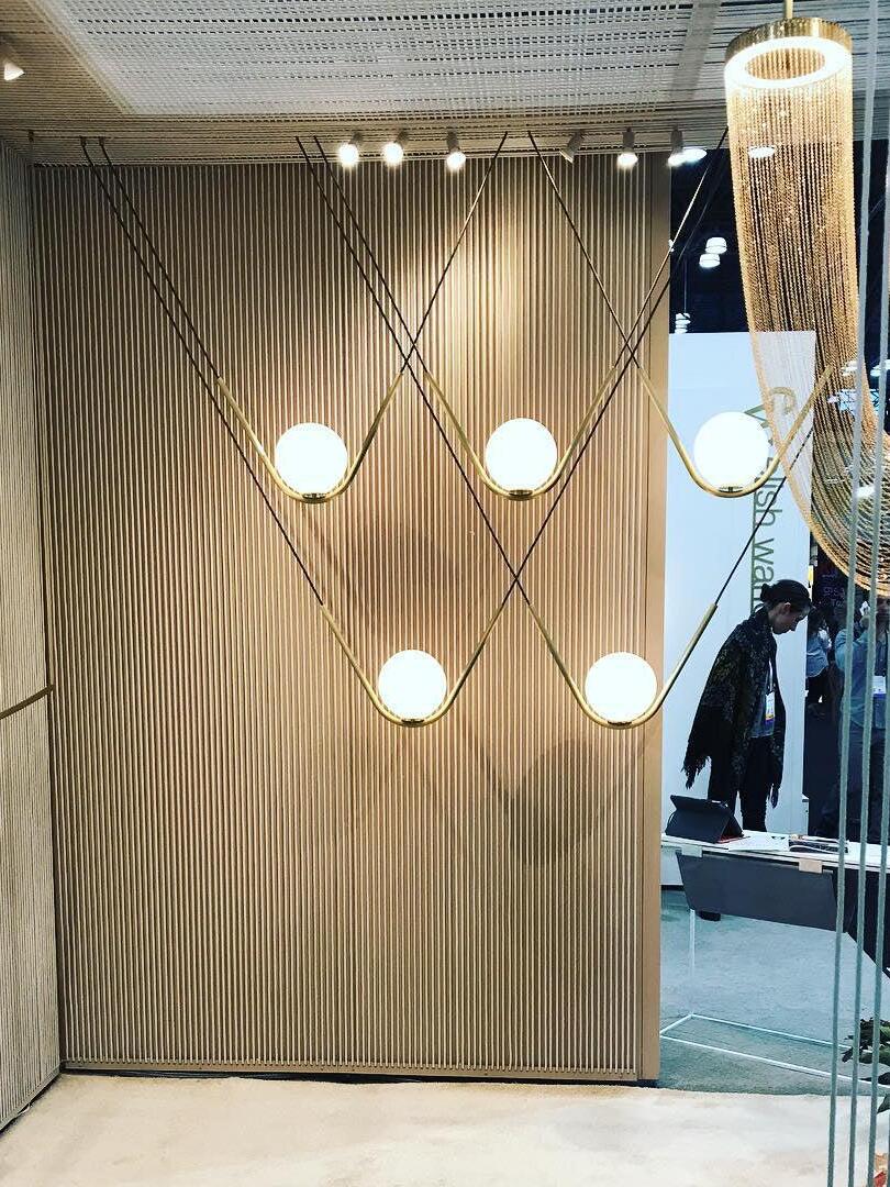 Chain fixtures and globe lights in a lighting display