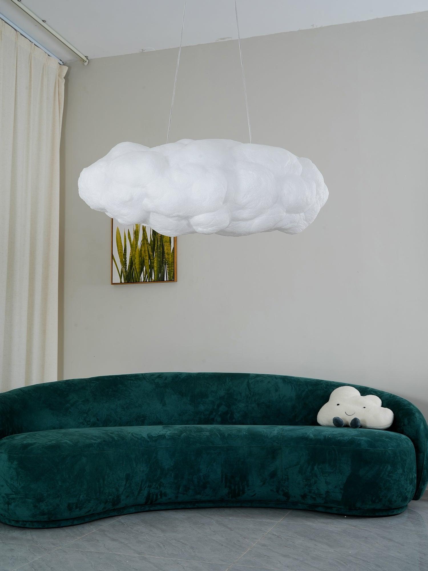 Unlit white cloud shade over a green sofa