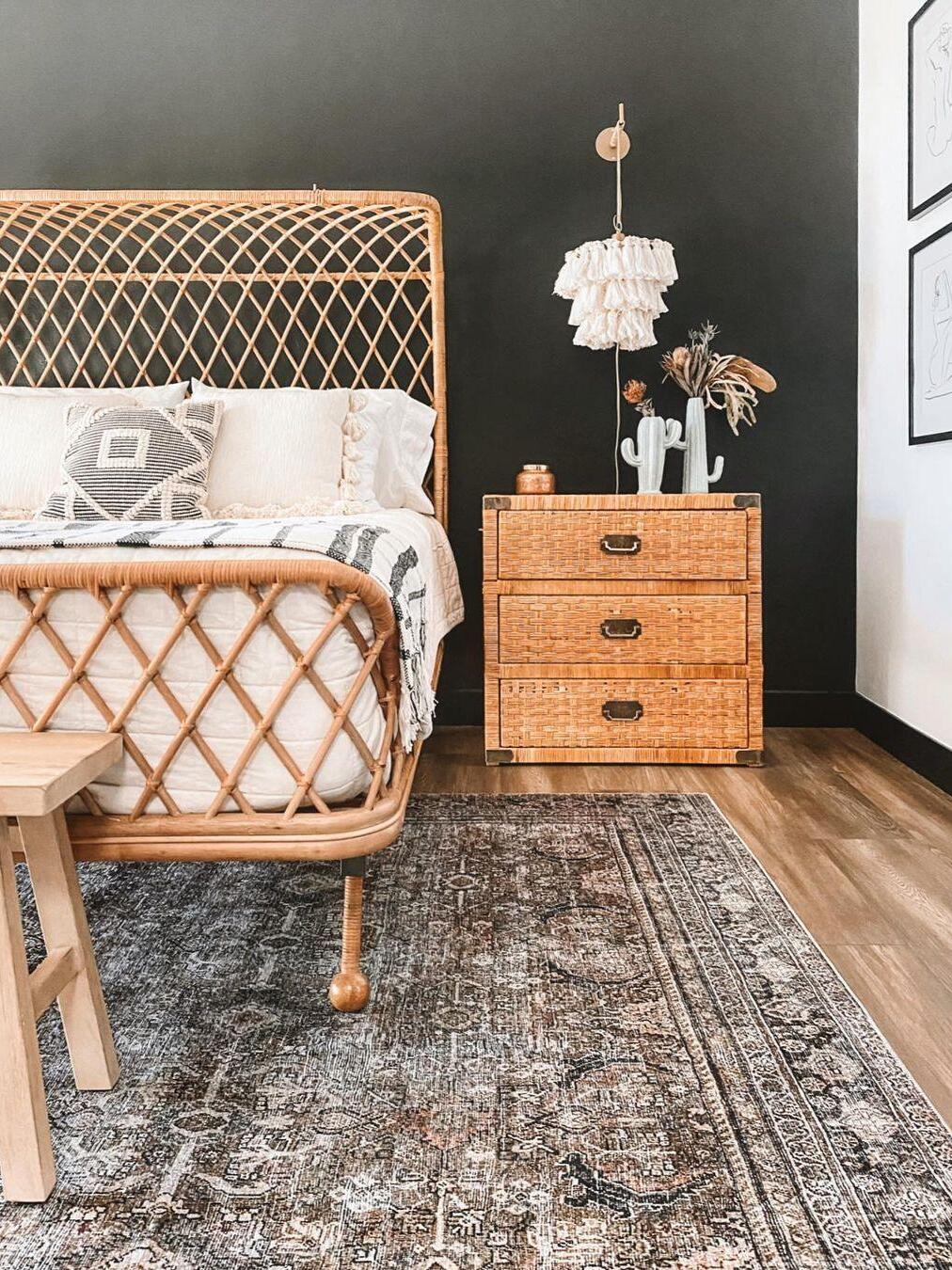 White tassel shade beside a wooden dresser