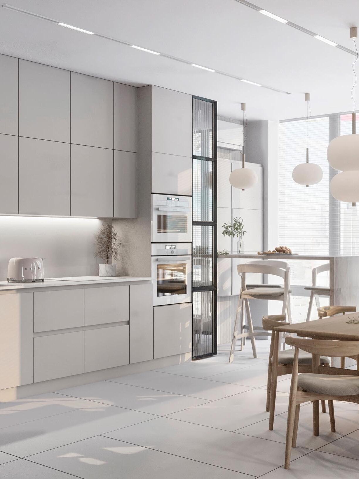 Single-globe pendants along a kitchen counter