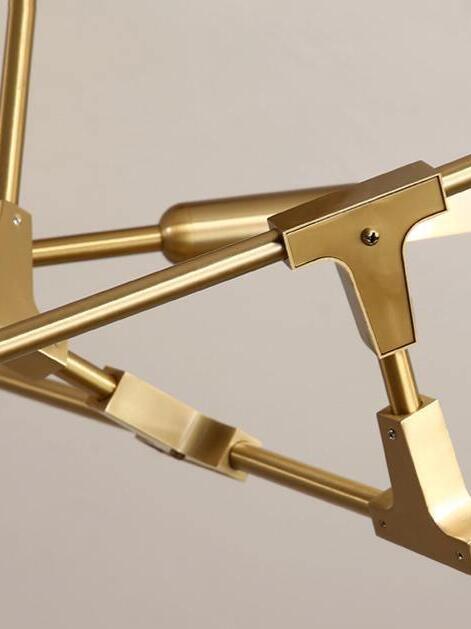 Gold articulated branch connector close-up