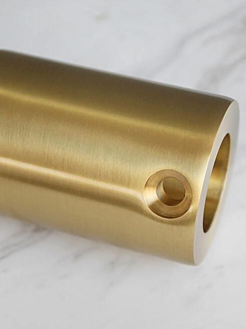 Side cable opening in separate gold-tone cylindrical housing