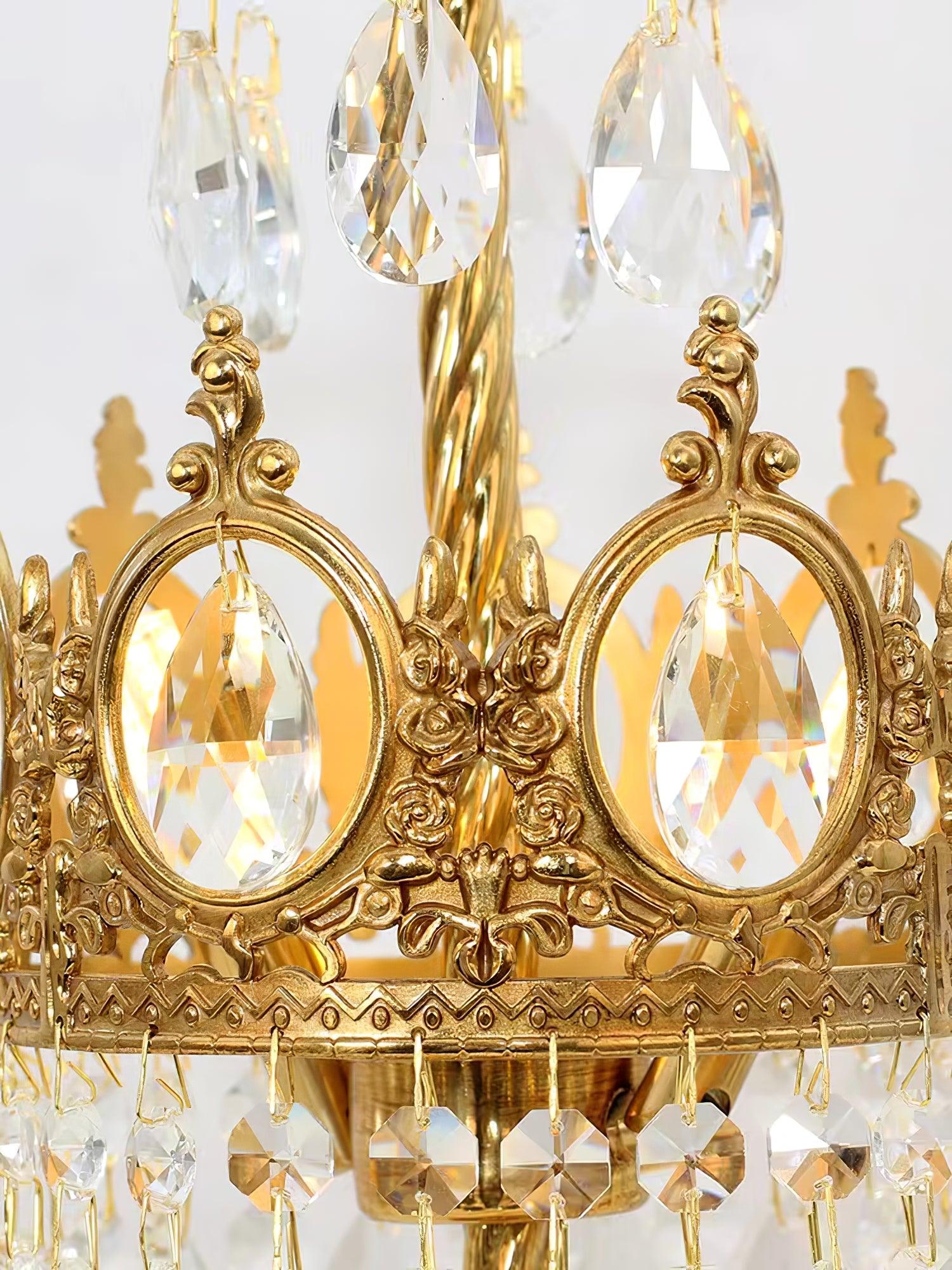 Detail of upper crystal drops, oval faceted crown crystals and gold-tone scrollwork.