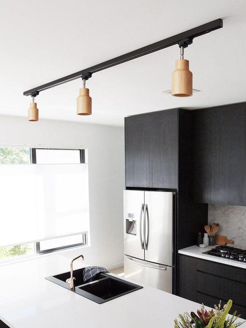 Wood track spotlights above kitchen island