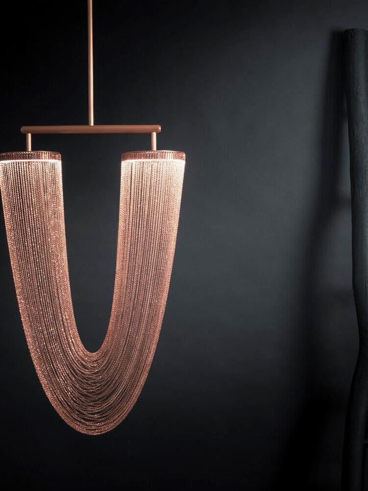 Rose-gold U-shaped chain fixture with a suspension rod