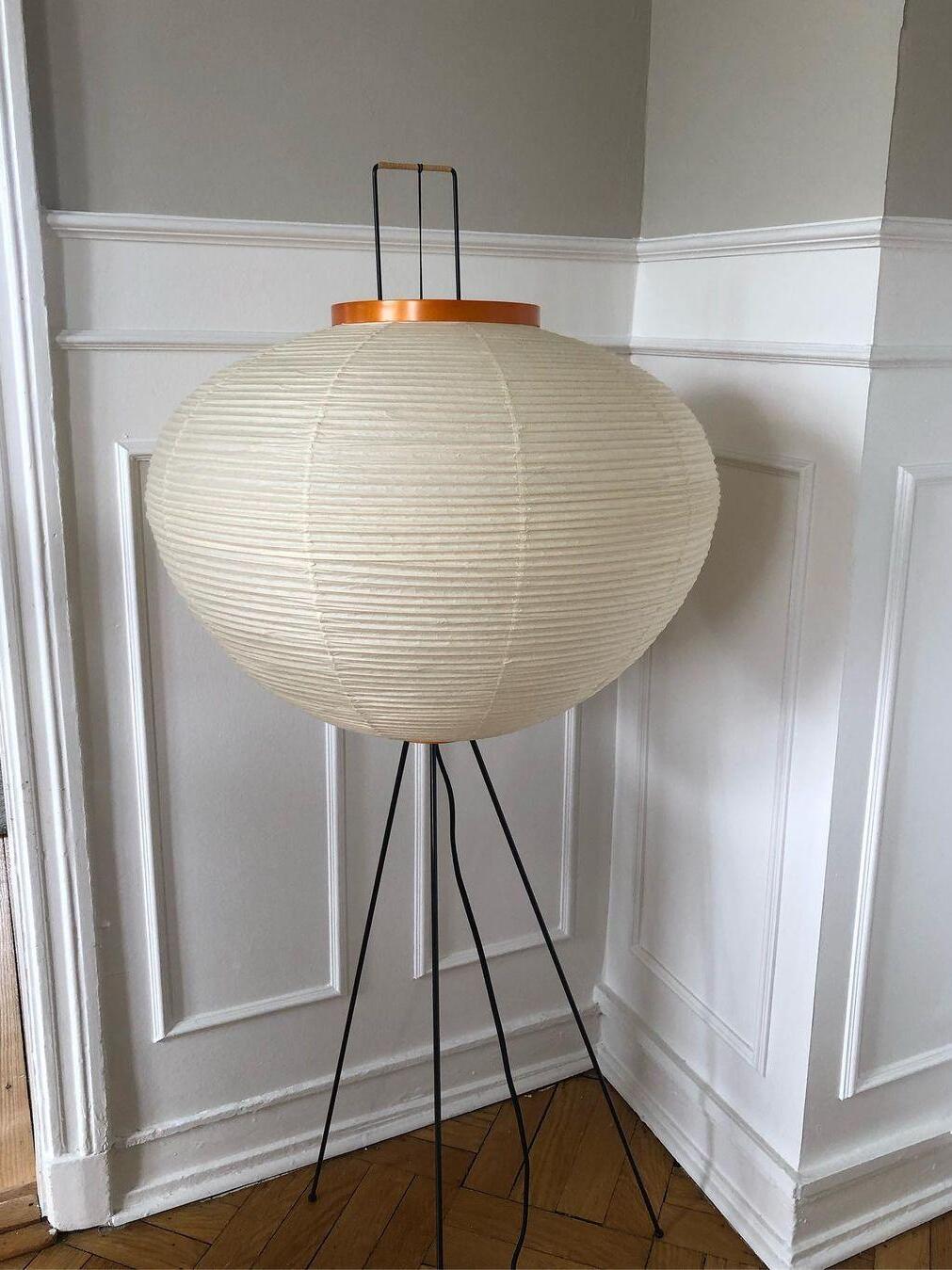 Ribbed round paper shade in room corner
