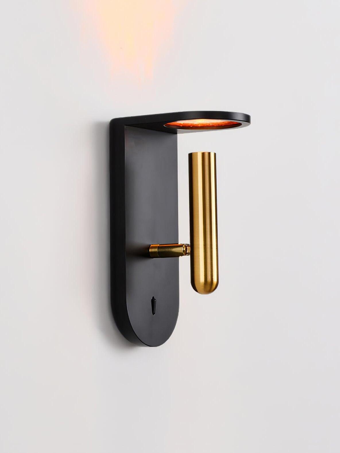 Black Nights wall light with a gold-tone head on a pivot joint beneath the round upper light