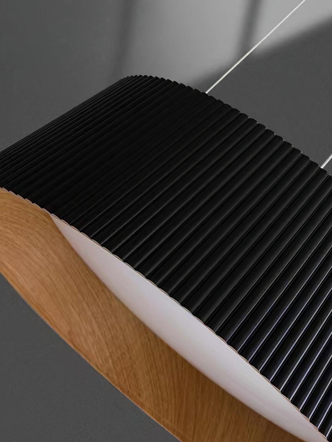 Angled close-up of Black vertical ribs, wood-grain-looking inner surface and recessed white diffuser