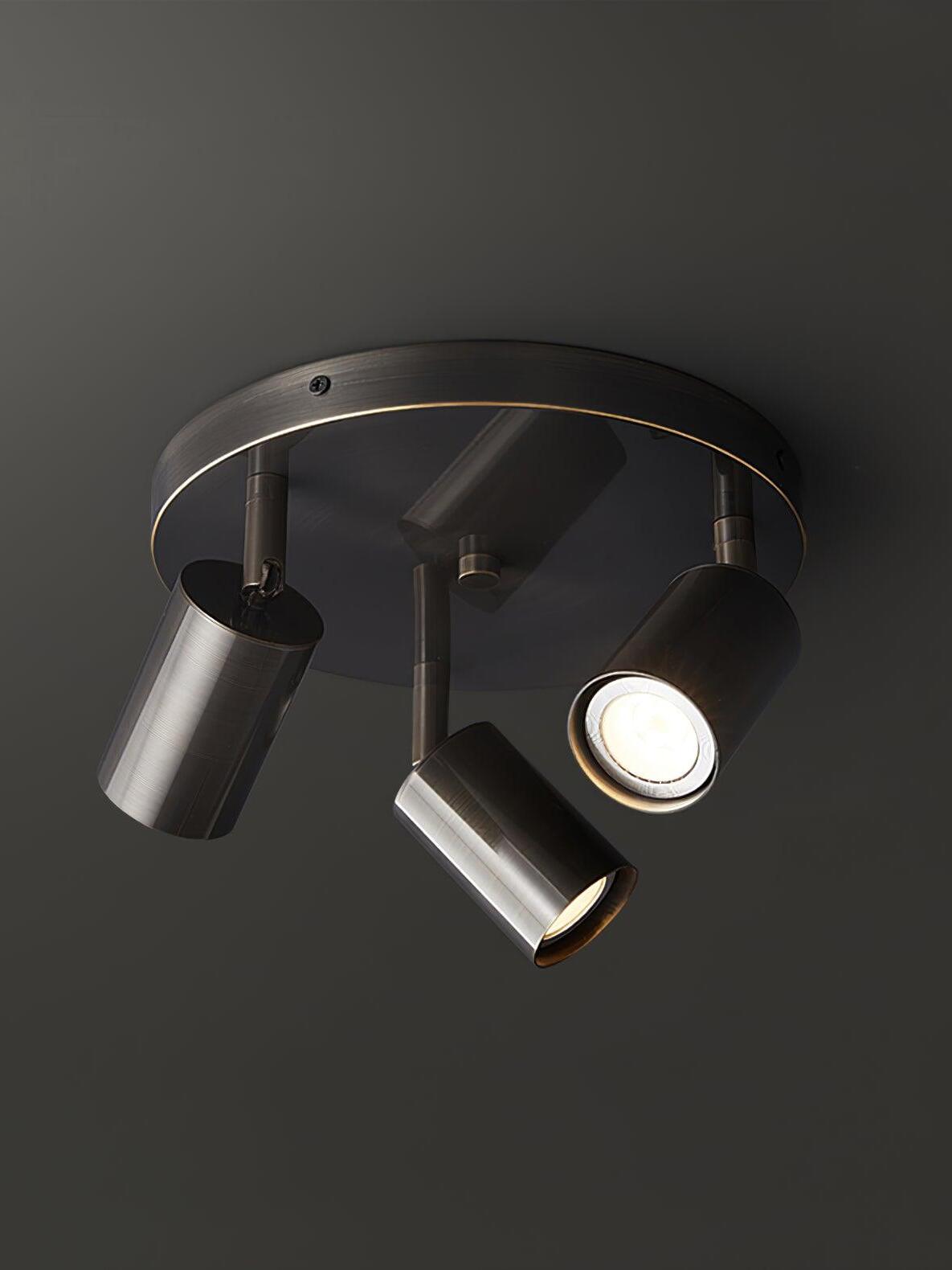 Black three-head Hugo spotlight on round ceiling plate