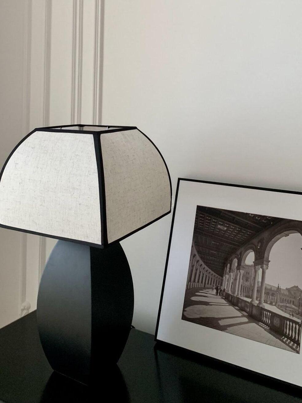 Fabric-shade Javier lamp beside framed print