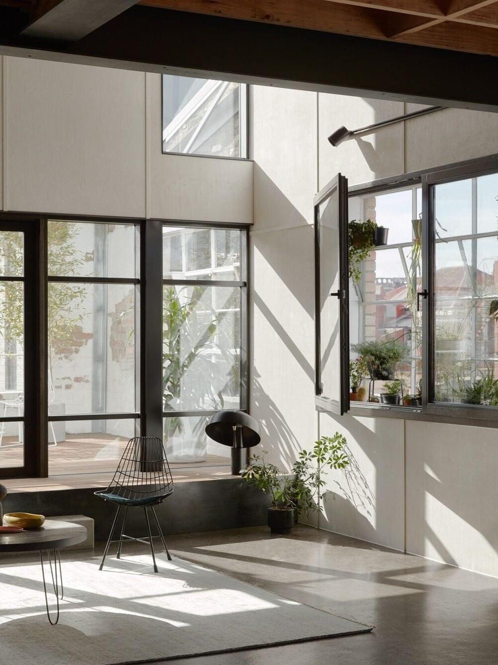 Black table lamp in bright-window living room