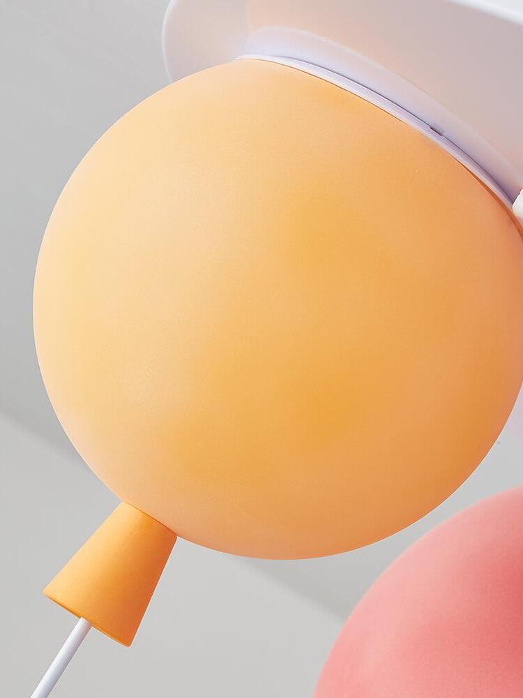 Orange balloon-shaped shade and tapered lower detail