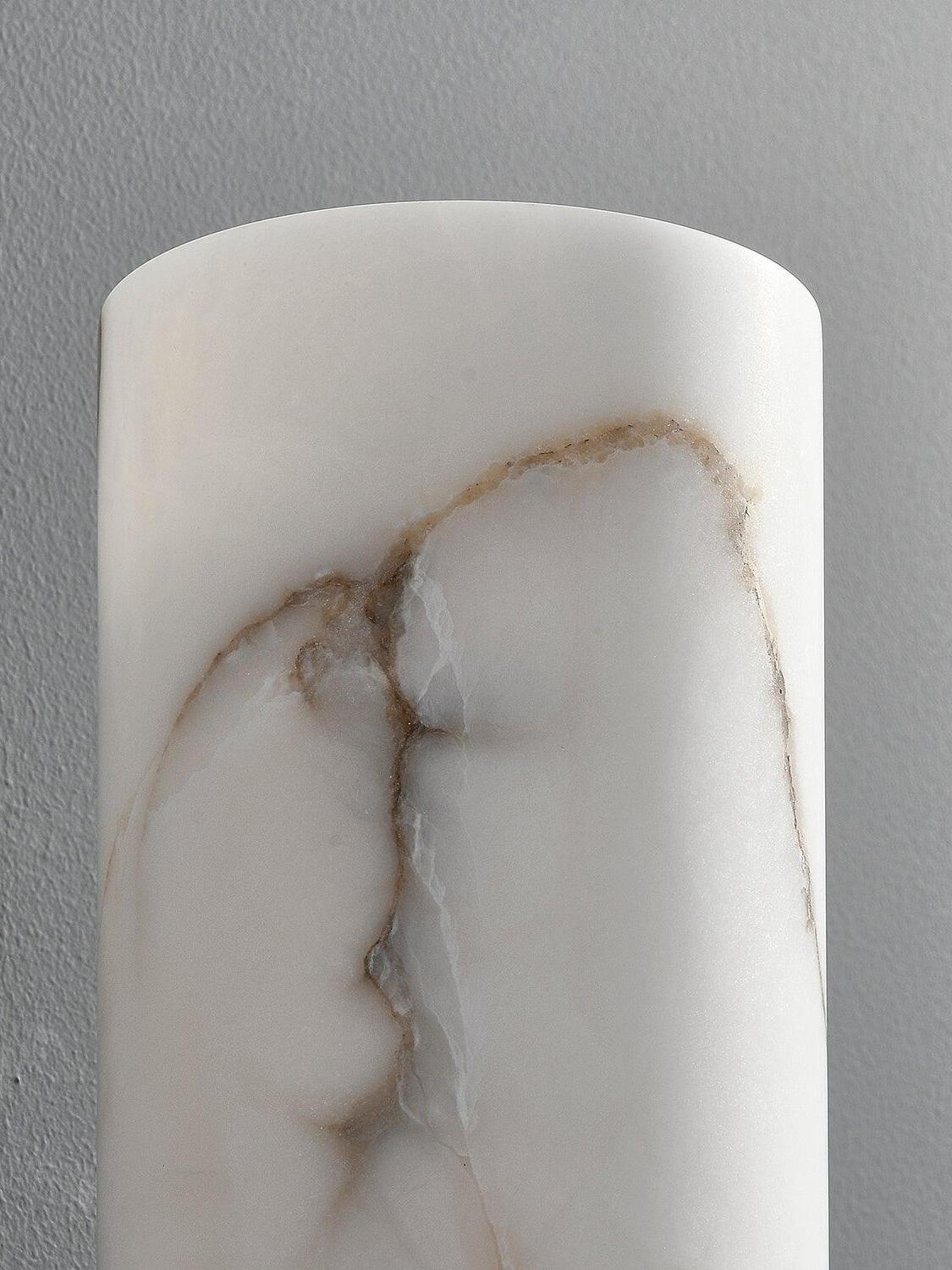 Close detail of pale marble shade with dark vein