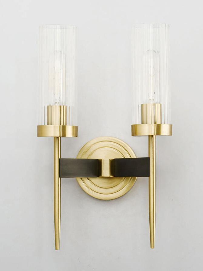 Unlit twin glass shades above long tapered stems
