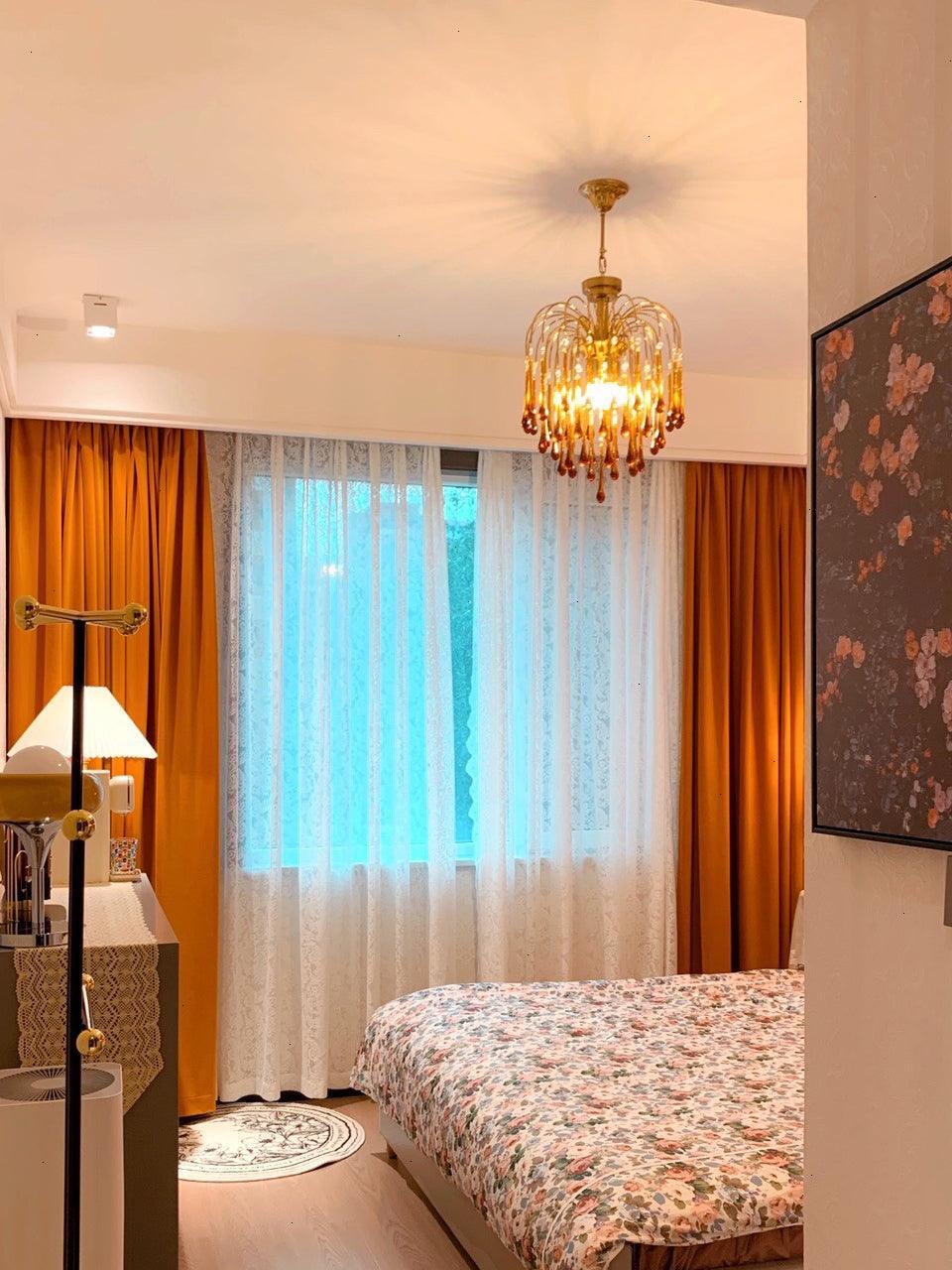Glowing crystal chandelier in a bedroom