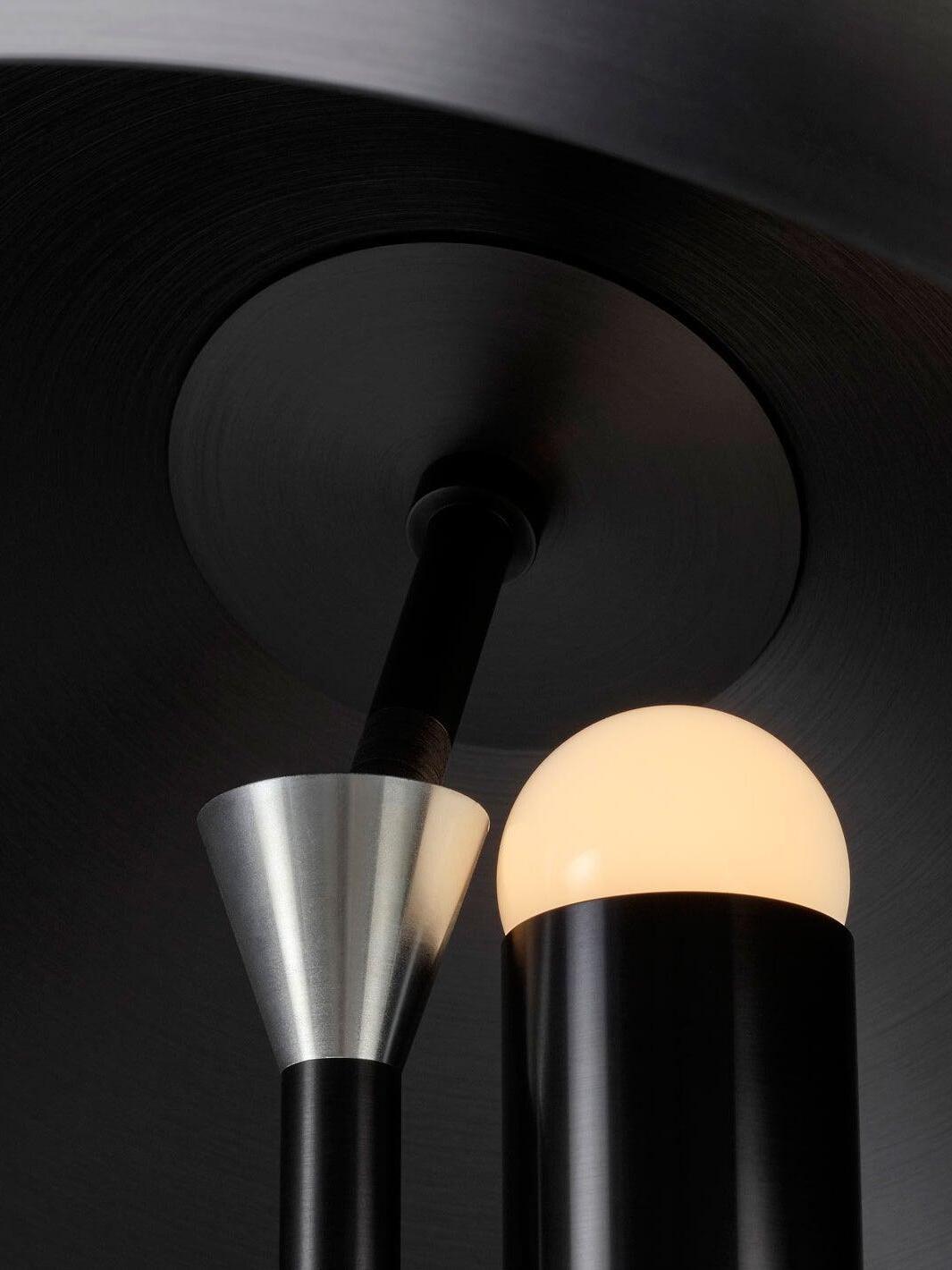 Underside of black dome with small glowing bulb