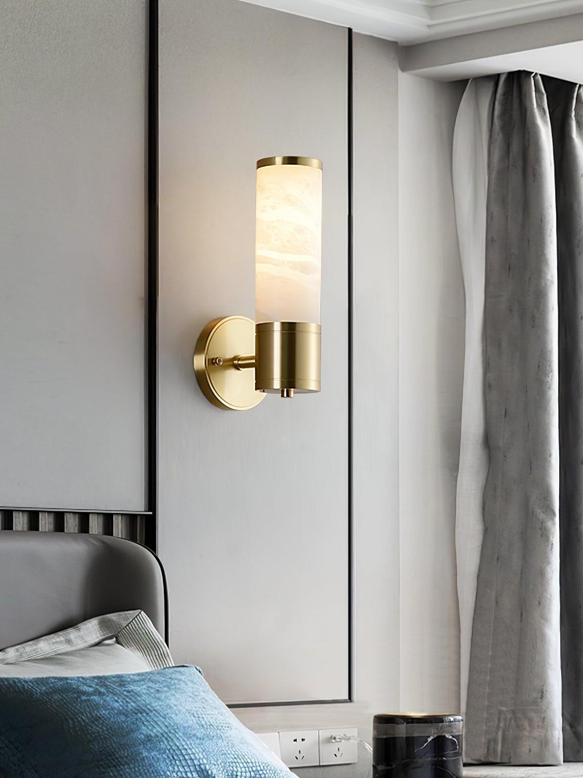 Short stone shade above brass wall fitting